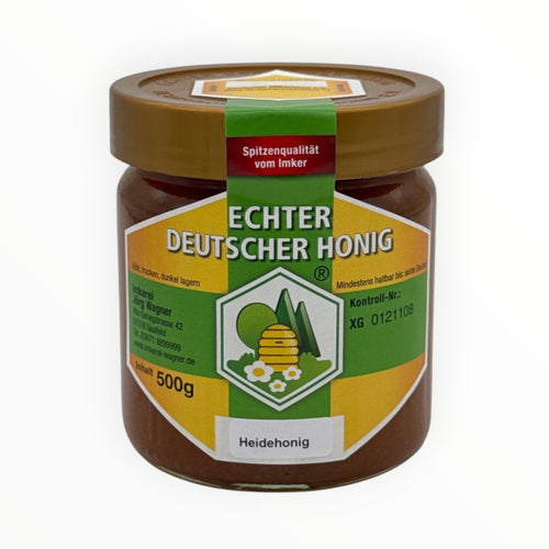 Bienenprodukte Shop Heidehonig im 500g Glas mit bernsteinfarbenem, geleeartigem Honig und Etikett.
