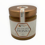 Bienenprodukte Shop Kornblumenhonig im 500g Glas mit goldenem Deckel und elegantem Etikett auf hellem Hintergrund