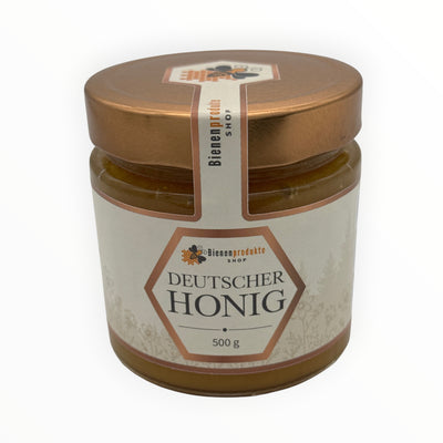 Bienenprodukte Shop Kornblumenhonig im 500g Glas mit goldenem Deckel und elegantem Etikett auf hellem Hintergrund