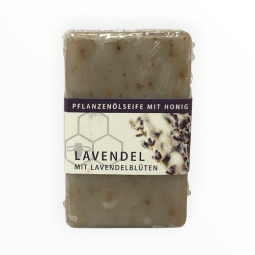 Bienenprodukte Shop Lavendel-Honigseife mit echten Lavendelblüten in transparenter Verpackung